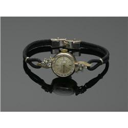LADY'S SWISS GOLD AND DIAMOND WRIST WATCH, OMEGA A LADY'S SWISS GOLD AND DIAMOND WRIST WATCH