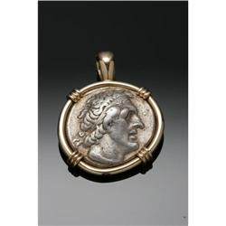 A FALCON AND FACE MEDALLION PENDANTMaker unknown A FALCON AND FACE MEDALLION PENDANT
