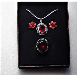 16)  SILVER TONE WITH GARNET RED CZ