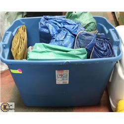 LARGE RUBBERMAID BIN FULL OF TARPS -
