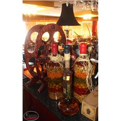 LOCATION #1. LOT OF 6 LAYERED OIL FILLED SEALED BOTTLES W/ WINE