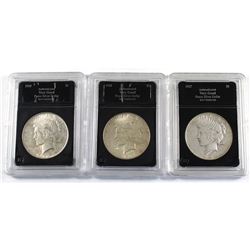 Group Lot 3x USA Silver Peace Dollars. Lot includes: 1925, 1926-S, & 1927-D. Coins come in hard acry