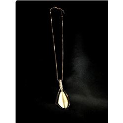 Contemporary, designer necklace with white opal rhinestone.