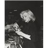 Image 1 : ANDRE DE DIENES, MARILYN MONROE, 1953 IN BOOK STORE.