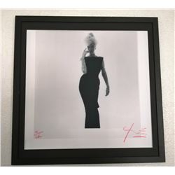 BERT STERN (1929-2013): Marilyn Monroe in black dress.