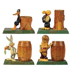 Collection of (4) Cast Metal Warner Bros. Banks.