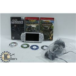 PSP WITH 7 GAMES AND NEW BATTERY AND CHARGER