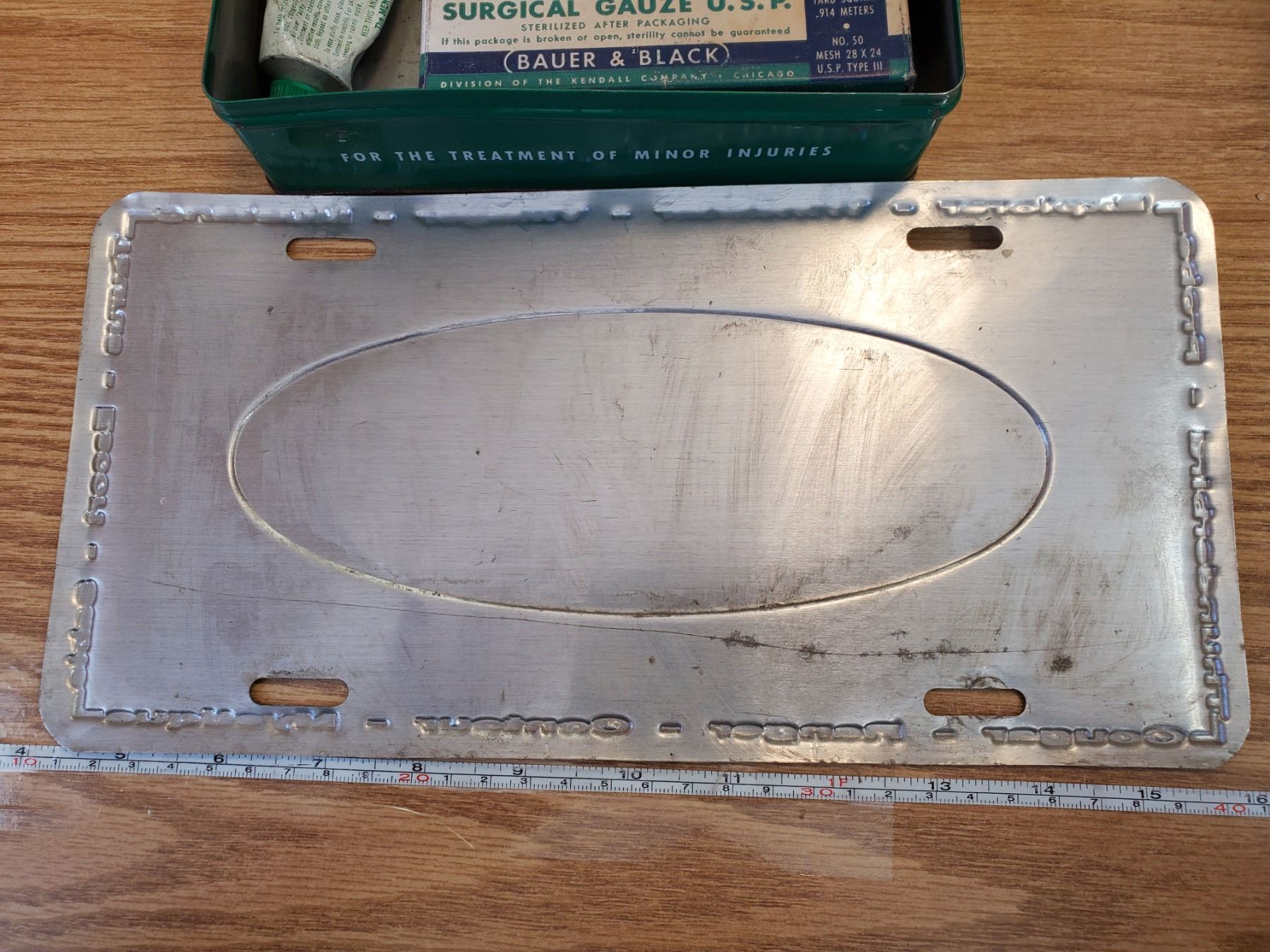 VINTAGE FORD LICENSE PLATE & FIRST AID KIT