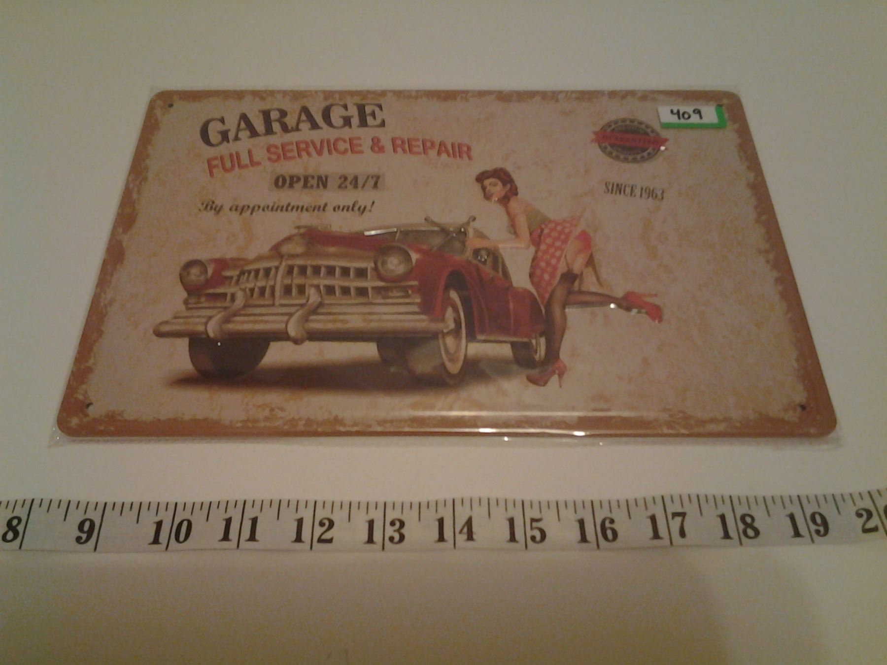 GARAGE TIN SIGN EMBOSSED (REPRO) - Schmalz Auctions