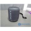 Image 2 : Sony Bluetooth Speaker, Anker Portable Power Bank, and Phone Cords