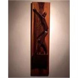 Carving  in wood of a women playing a harp #876878