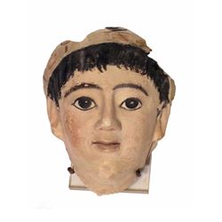 A Romano-Egyptian Stucco Mask of a Boy.