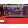 Image 3 : Two 1:18 scale die cast cars in package bmw and jaguar (Boxes in rough shape)