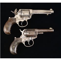 2 COLT 1877 DA REVOLVERS.