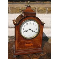 Striking mahogany clock #879333