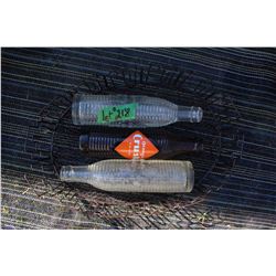 Three Orange Crush Bottles