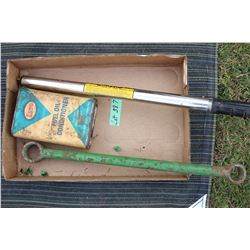 Flat with a Cattle Prod, a Combination Wrench and an Esso Fuel Conditioner Can