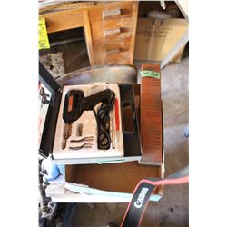 Flat with a Soldering Gun and a Soldering Iron