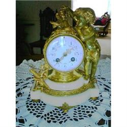 French Bronze depicting a putto studing hour #888381