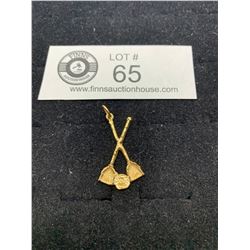 A 10k Gold Curling Charm Pendant