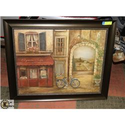 FRAMED PICTURE OF CAFÉ WITH BIKE.