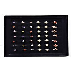 11)  LOT OF 42 FASHION RINGS IN BLACK