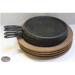 LOT OF 4 CAST IRON ROUND GRIDDLE W/ WOODEN COASTER