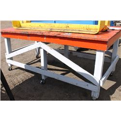 ORANGE WORK TABLE ON CASTORS