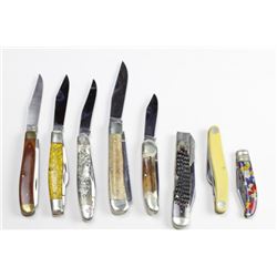 Collection of 8 pocket knives with storage case.