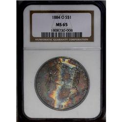 1884-O S$1 MS65 NGC. Exuberant cherry-red, apple-green