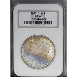 1885-O S$1 MS65 NGC. Lustrous surfaces are bathed by s
