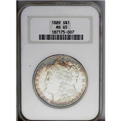 1889 S$1 MS65 NGC. Golden-brown and aquamarine toning