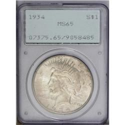 1934 S$1 MS65 PCGS. Dusky golden toning subdues the un