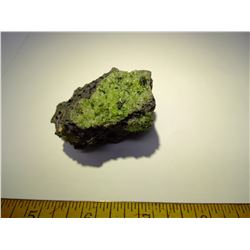 PERIDOT CRYSTAL ON LAVA