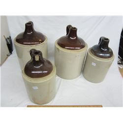 Lot of 4 stoneware jugs 1 and 2 gal chips and cracks 1 good