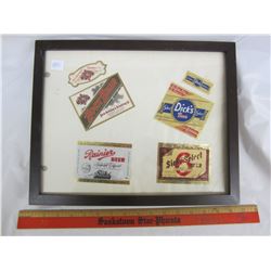 Framed vintage beer bottle labels