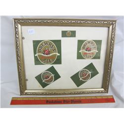 Framed vintage beer bottle labels
