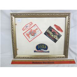 Framed vintage beer bottle labels