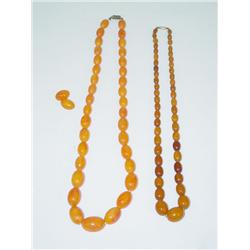 (2) STRANDS OF AMBER BEADS: (1) 20 HON