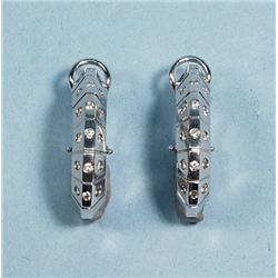 A pair of unusual 18 kt. white gold and