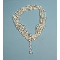 A seven strand diamond and seed pearl c