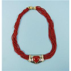 An attractive 18 kt. gold and coral nec