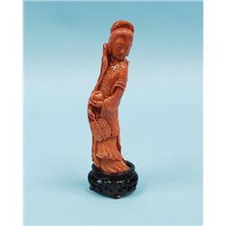 An antique Chinese coral figure of a Qu