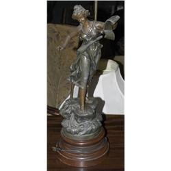 CAST METAL FIGURAL LAMP on a faux marbl