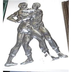 CAST METAL RELIEF OF WRESTLERS