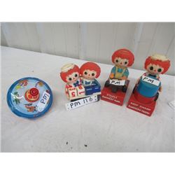 PM- Pkg of Toys- 3 Raggedy Anne, 1 Battery Operated Toy, 1 Calendar , 1 Metal Top