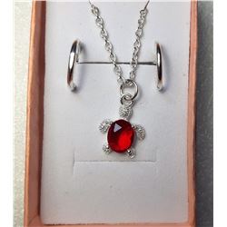 23)  SILVER TONE WITH CLEAR AND RED CZ