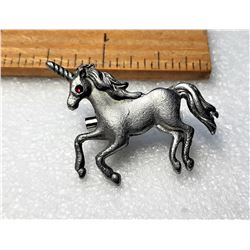 24)  PEWTER UNICORN BROOCH WITH RED