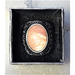 15)  OVAL PEACH AGATE  RING SET IN A