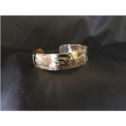 Patrick Seaweed Split Eagle Gold Bracelet , Donated by:  Friend of DEWC Appraised Value: $2000
